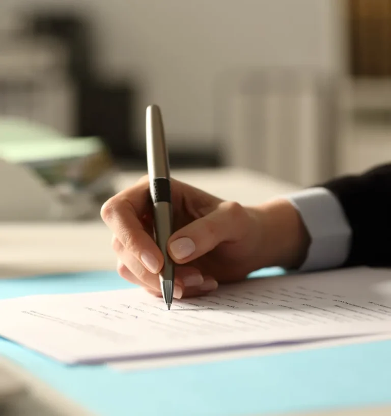 Person ticking boxes on paper